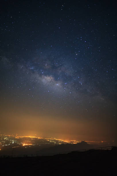 istock milky way galaxy and city light at Phutabberk 836598334