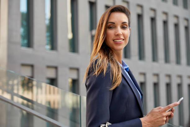 istock Portrait of professional using smart phone in city 836598804