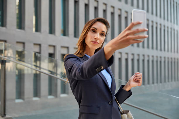 istock Professional taking selfie against office building 836598808