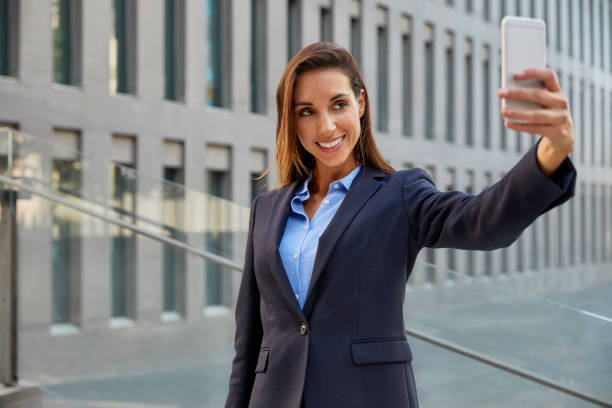 istock Professional taking selfie on smart phone in city 836598858