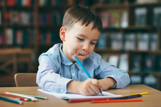 istock Preschool boy drawing 836599386