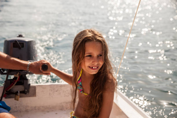 istock Father And Daughter Steering Boat On  Mediterranean Sea 836600184