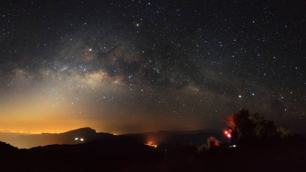 istock Milky Way Galaxy with light city at Doi inthanon 836602250
