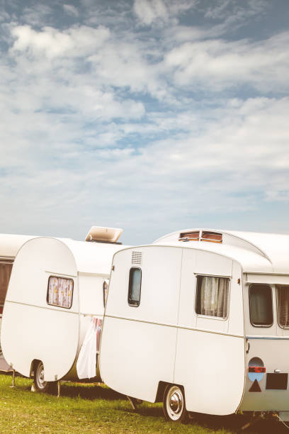 istock Row of three vintage restored caravans 836602992