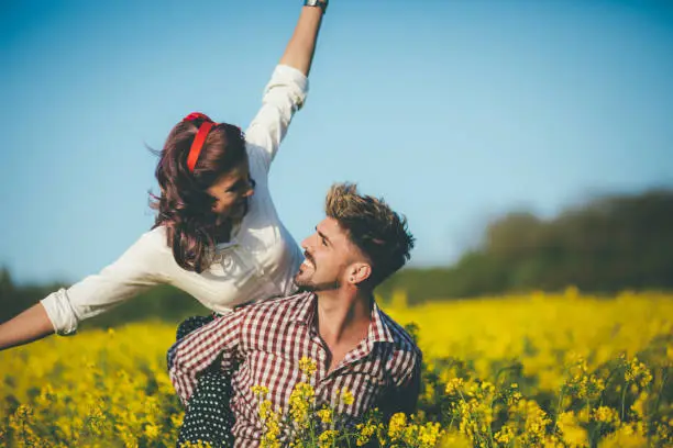 Vintage romance in rapeseed field