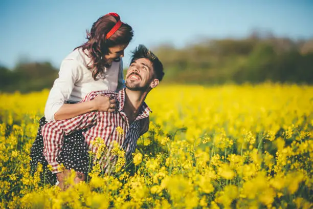 Vintage romance in rapeseed field