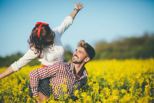 Vintage romance in rapeseed field