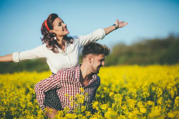 Vintage romance in rapeseed field