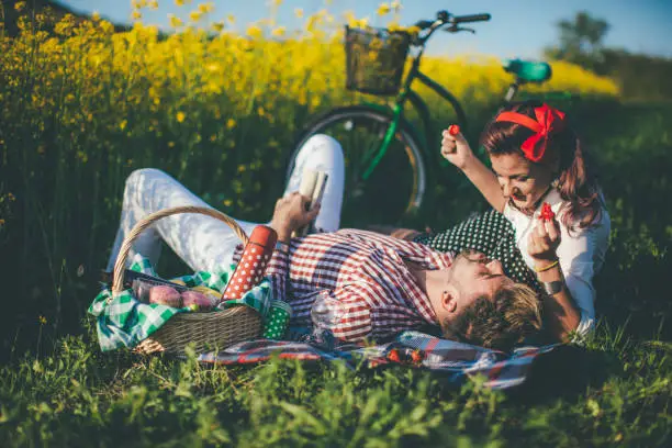 Young Couple Picnic At Sunset