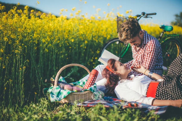 Young Couple Picnic At Sunset