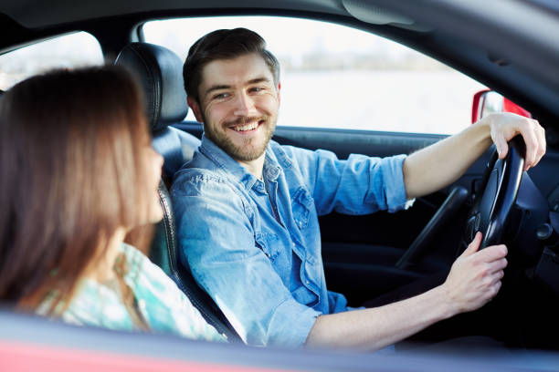 istock Beautiful couple driving the car 836606996