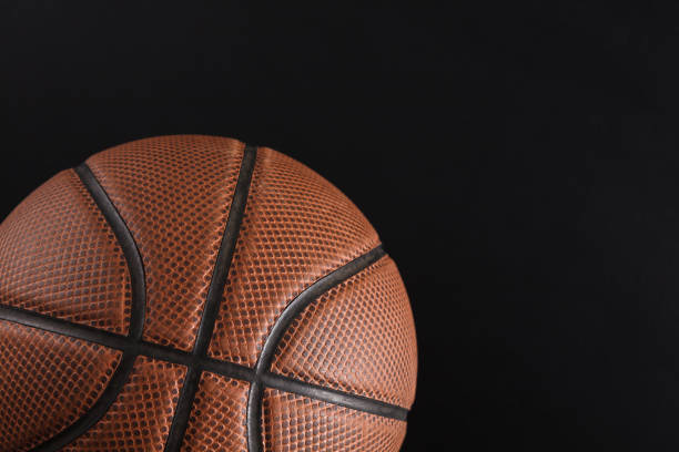 istock Old basketball ball on black background copy space 836607754