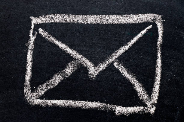 istock White chalk drawing in mail envelope icon on black board background 836610288