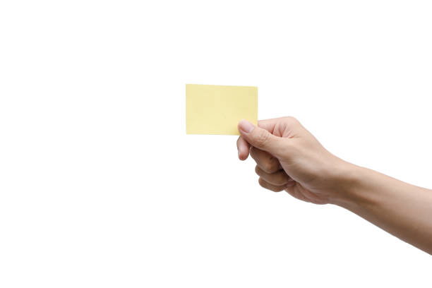 istock Hand holding yellow paper isolated on white with clipping path 836618598