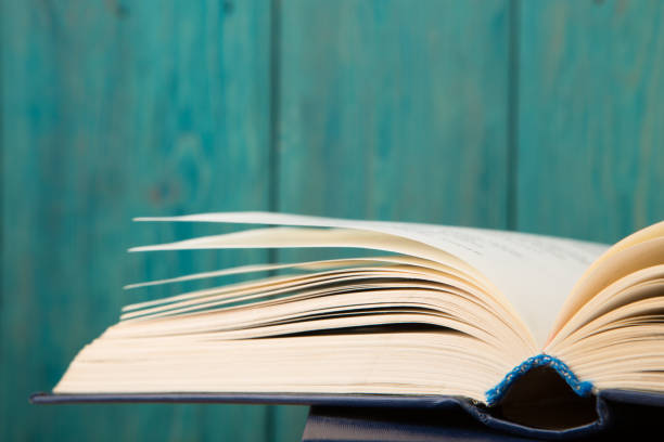 istock Open book on the desk over wooden background 836627542