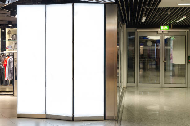 istock White blank advertising board in front of a shop with copy space 836631140