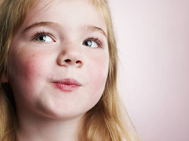 Smirking 4 year old girl.   child behaving badly stock pictures, royalty-free photos & images
