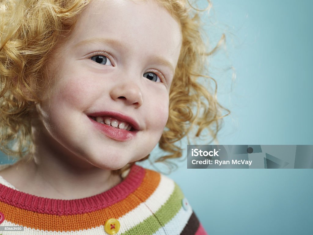 Portrait of a smiling 3 year old girl.   2-3 Years Stock Photo