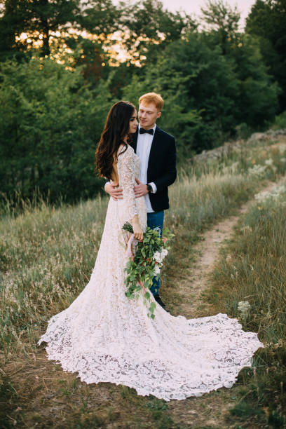 istock Happy newlyweds standing and hugging 836641684