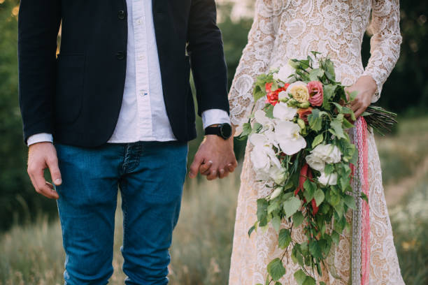 istock happy couple holding hands and walking 836642140