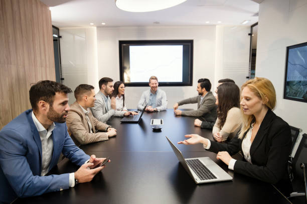 istock Perspective businesspeople having meeting in conference room 836642438