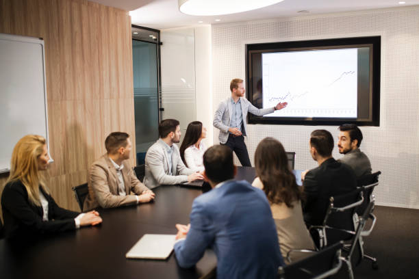 istock Young attractive businessman showing presentation to his colleagues 836642688