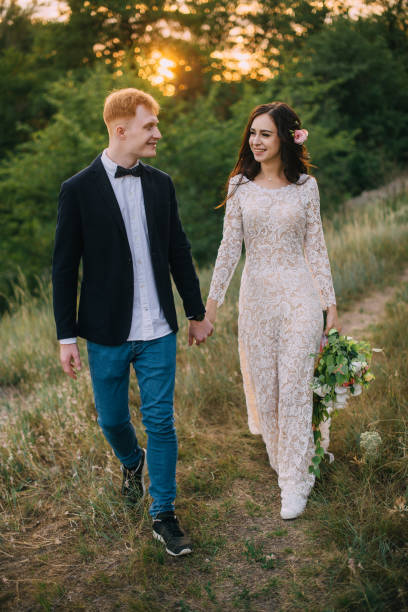 istock happy couple holding hands and walking 836642850