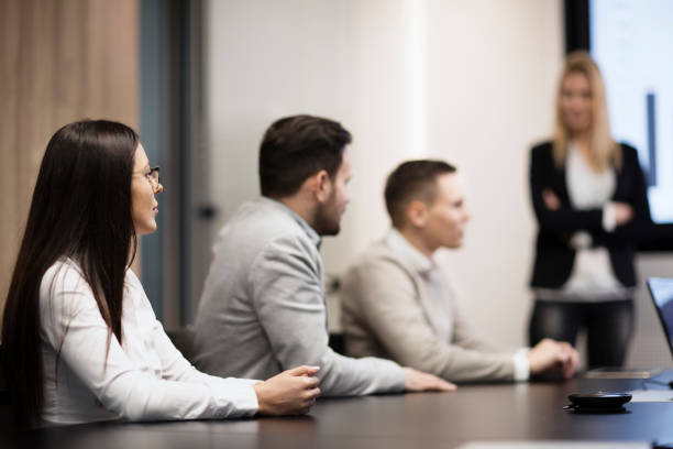 istock Perspective businesspeople having meeting in conference room 836643152