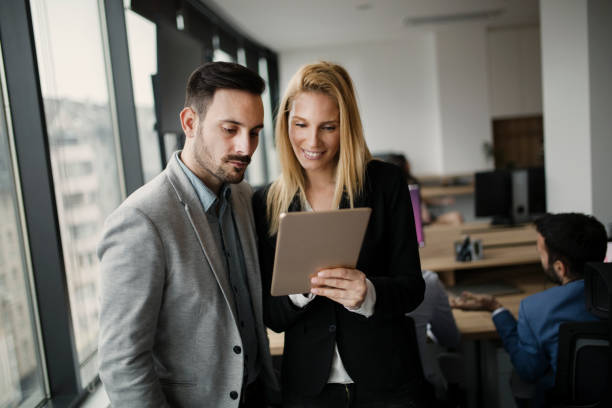 istock Portrait of attractive business partners using tablet 836646374