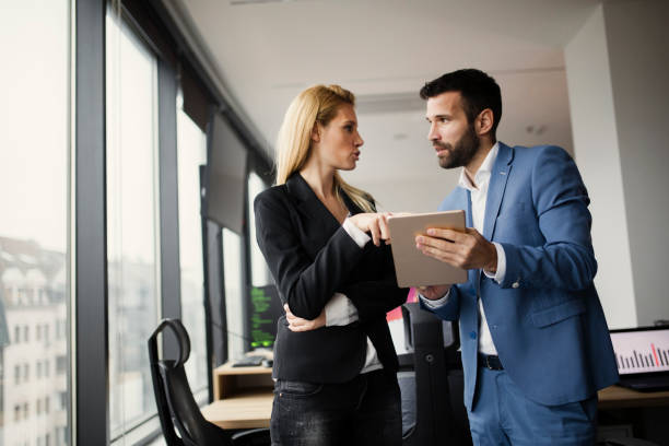 istock Portrait of attractive business partners using tablet 836648614