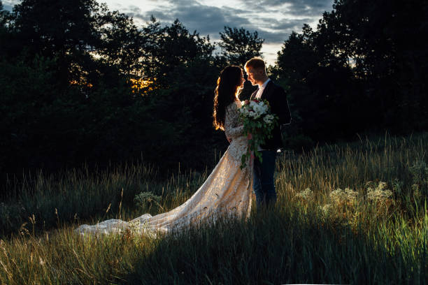 istock Newlyweds standing and hugging outdoors 836648654