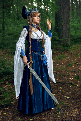 Valkyrie warrioress in magpie costume. Styling for the Scandinavian women's costume of the Viking Age.