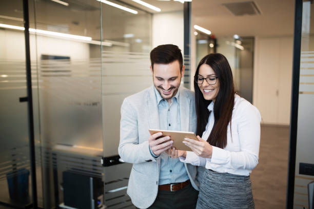 istock Portrait of attractive business partners using tablet 836649486