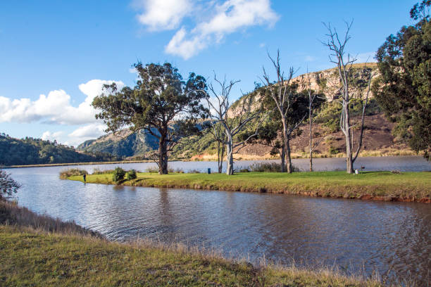 istock Lake Island Against Mountain and Valley Cloudy Blue Sky 836649562