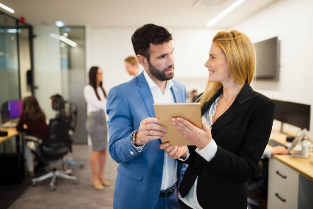 istock Portrait of attractive business partners using tablet 836649850