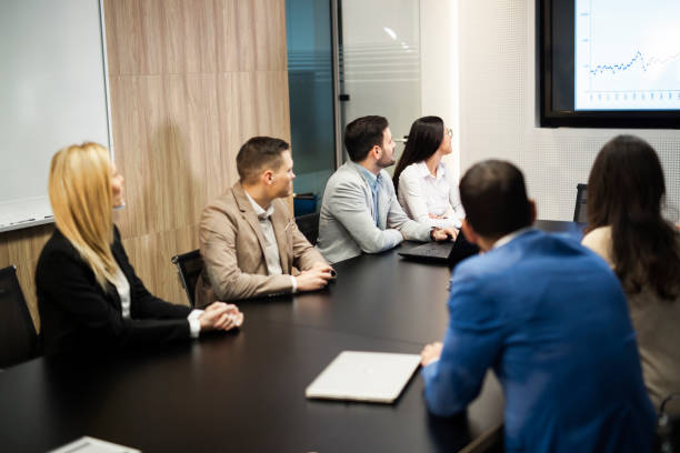 istock Perspective businesspeople having meeting in conference room 836653572
