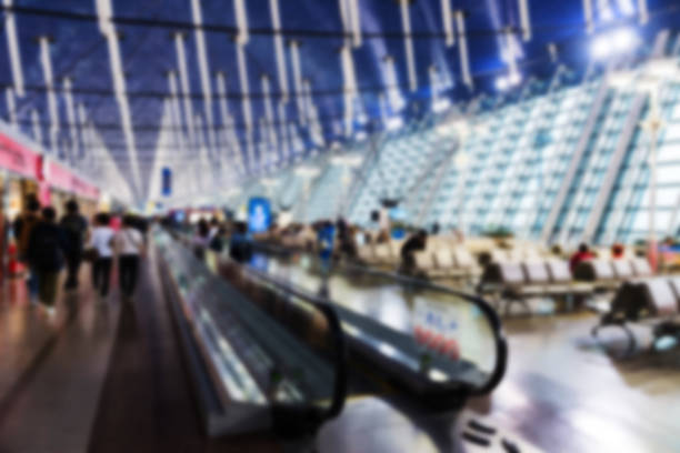 istock Blurred image of many people at airport terminal 836653606
