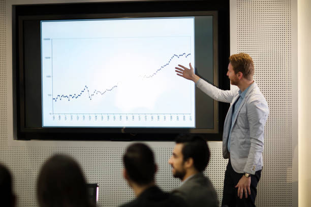 istock Young attractive businessman showing presentation to his colleagues 836653670