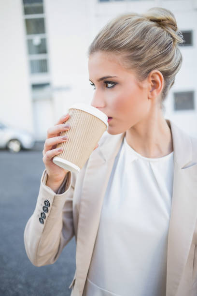 istock Relaxed stylish businesswoman drinking coffee 836653808