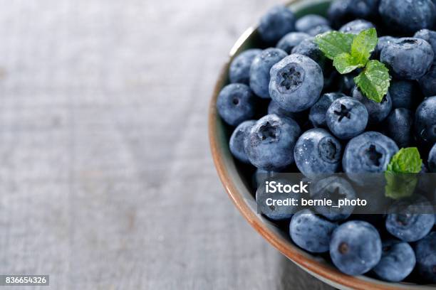 Blueberries On Wooden Table Stock Photo - Download Image Now - Blueberry, Wood - Material, Agriculture