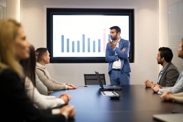 istock Young attractive businessman showing presentation to his colleagues 836654352