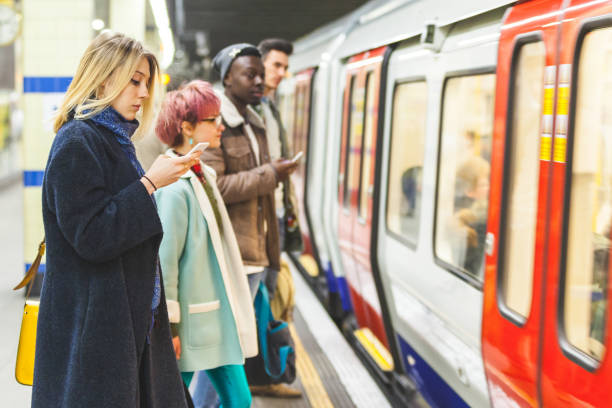 people waiting for the train at subway station - women travel destinations london england tourist imagens e fotografias de stock