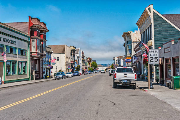 Ferndale, California, USA - August 11, 2016: This view of Main Street shows many varieties of signs as well as architectural features with vehicles parked on both sides of this roadway with walkways on bothe sides and many retail outlets and on this august day it is a pleasant visit.