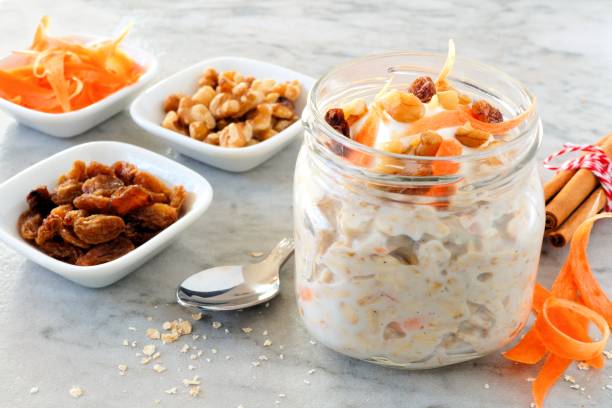 istock Carrot overnight oats with nuts and raisins in a mason jar on marble 836662458