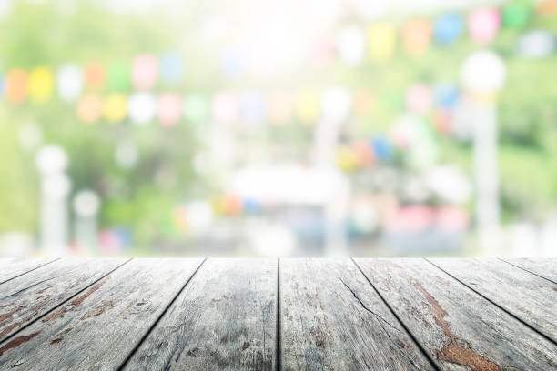 istock Empty wooden table with party in garden background blurred. 836666308