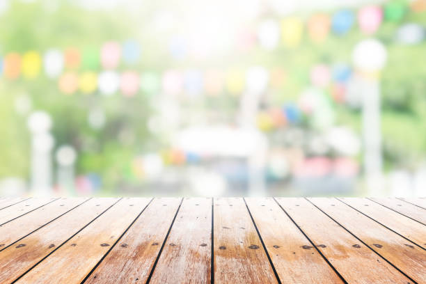 istock Empty wooden table with party in garden background blurred. 836666536