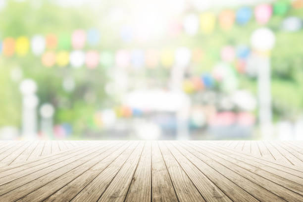 istock Empty wooden table with party in garden background blurred. 836666612