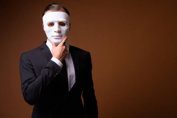 Studio shot of young businessman against colored background horizontal shot