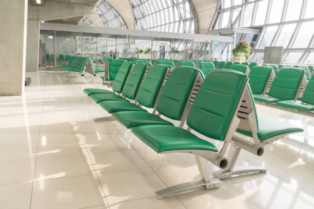 istock Empty airport terminal waiting area with chairs in morning time. 836672746