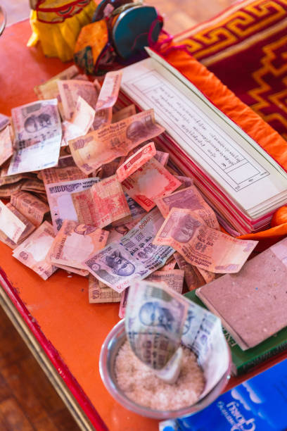 Table with money for making merit Inside Guru Rinpoche Temple at Namchi. Sikkim, India.